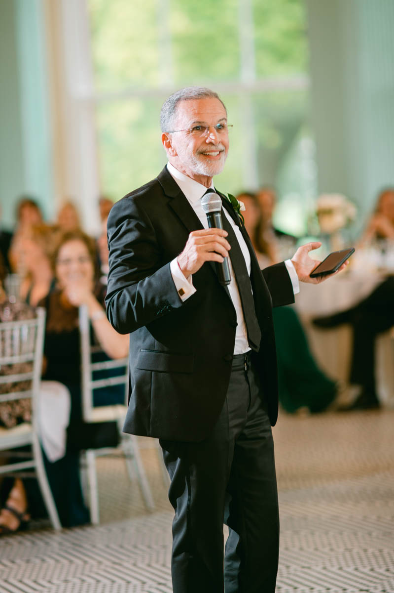 Father of the groom toasting wedding couple.