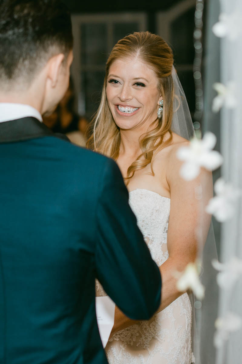 Bride looking at her groom during ceremony.