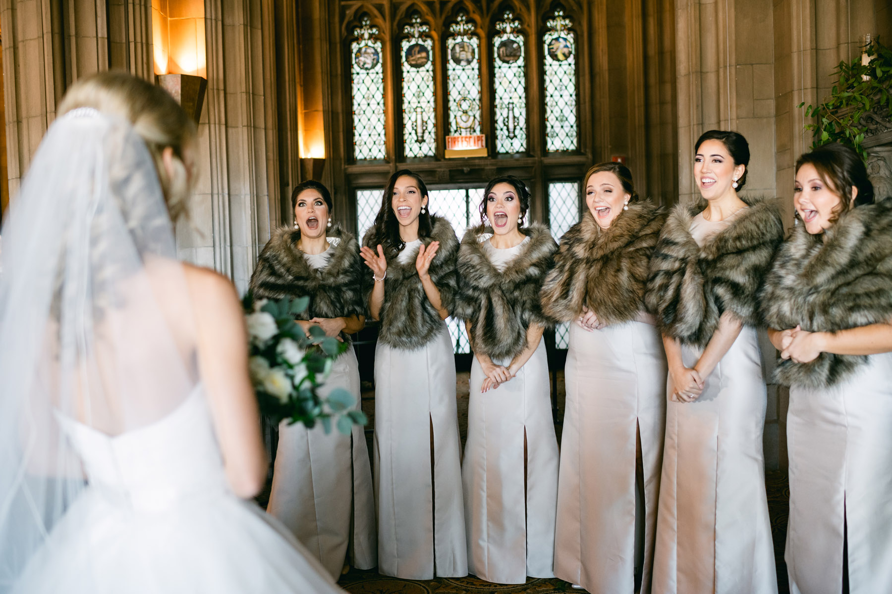 Bridesmaids excited to see bride at the University Club of Chicago