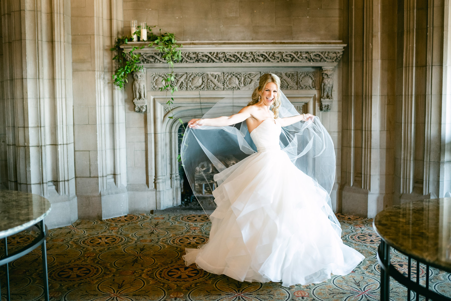 Bride playing in her wedding dress at the University Club of Chicago