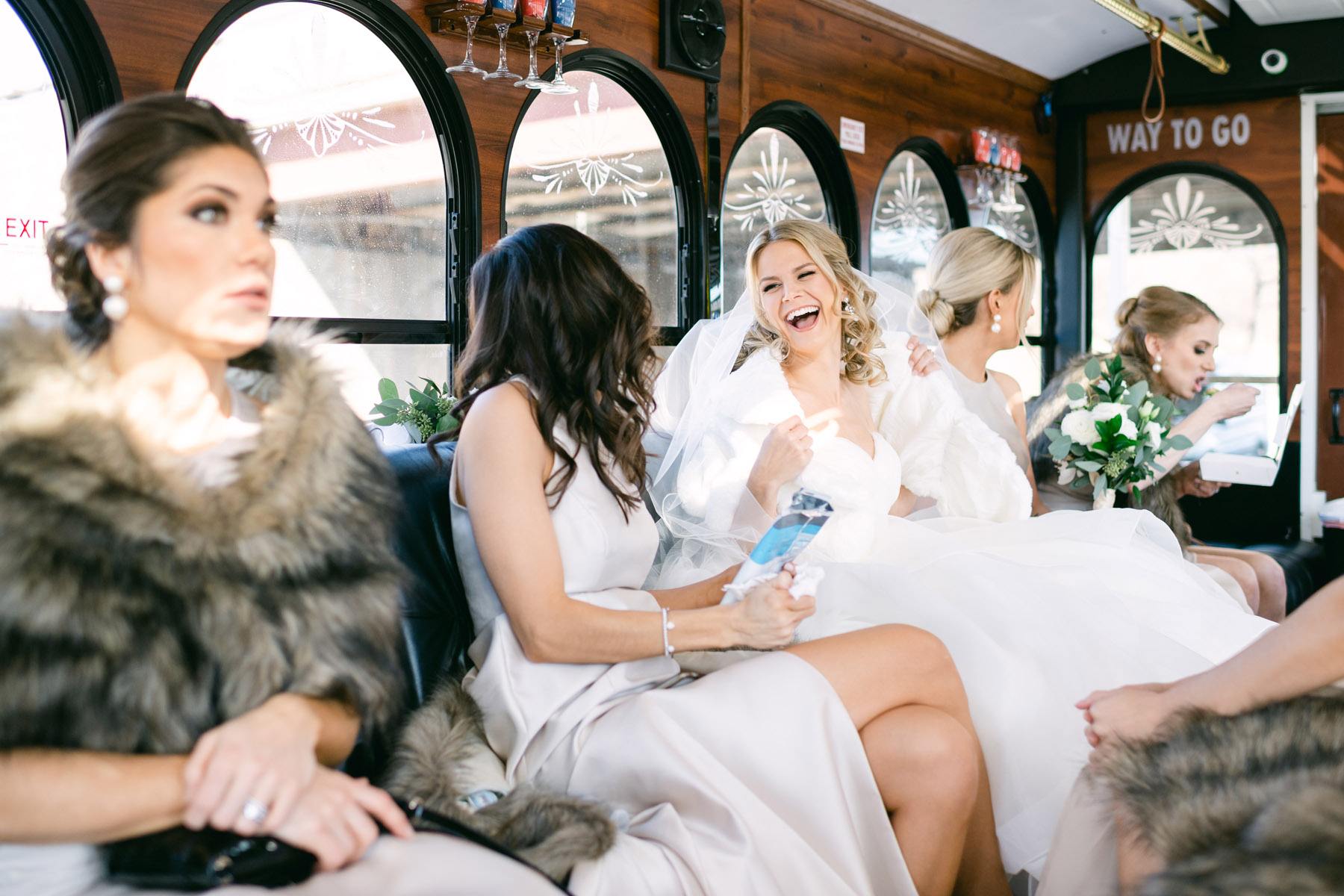 Bride with bridesmaids on the way to ceremony.