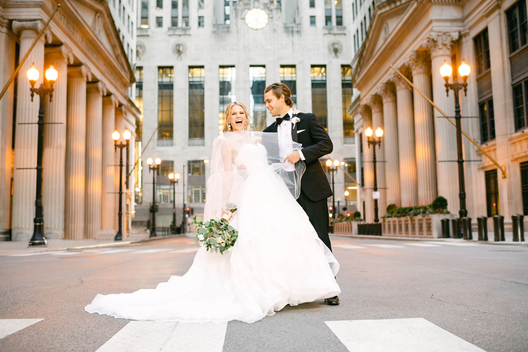 Wedding couple posing for photos at the Chicago Board of Trade.