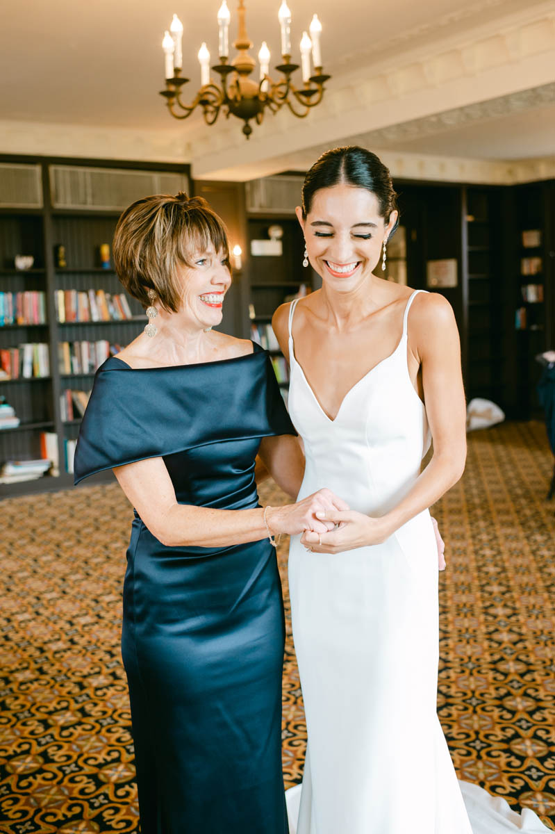 Bride and her mom laughing