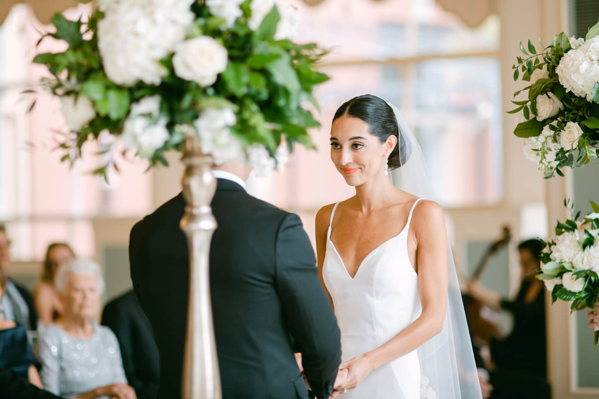 Bride looking at groom during South Shore Cultural Center wedding.