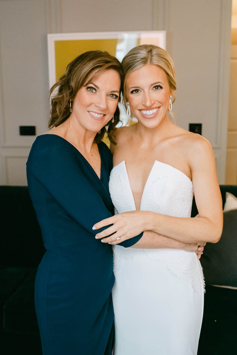 Bride posing with her mom.