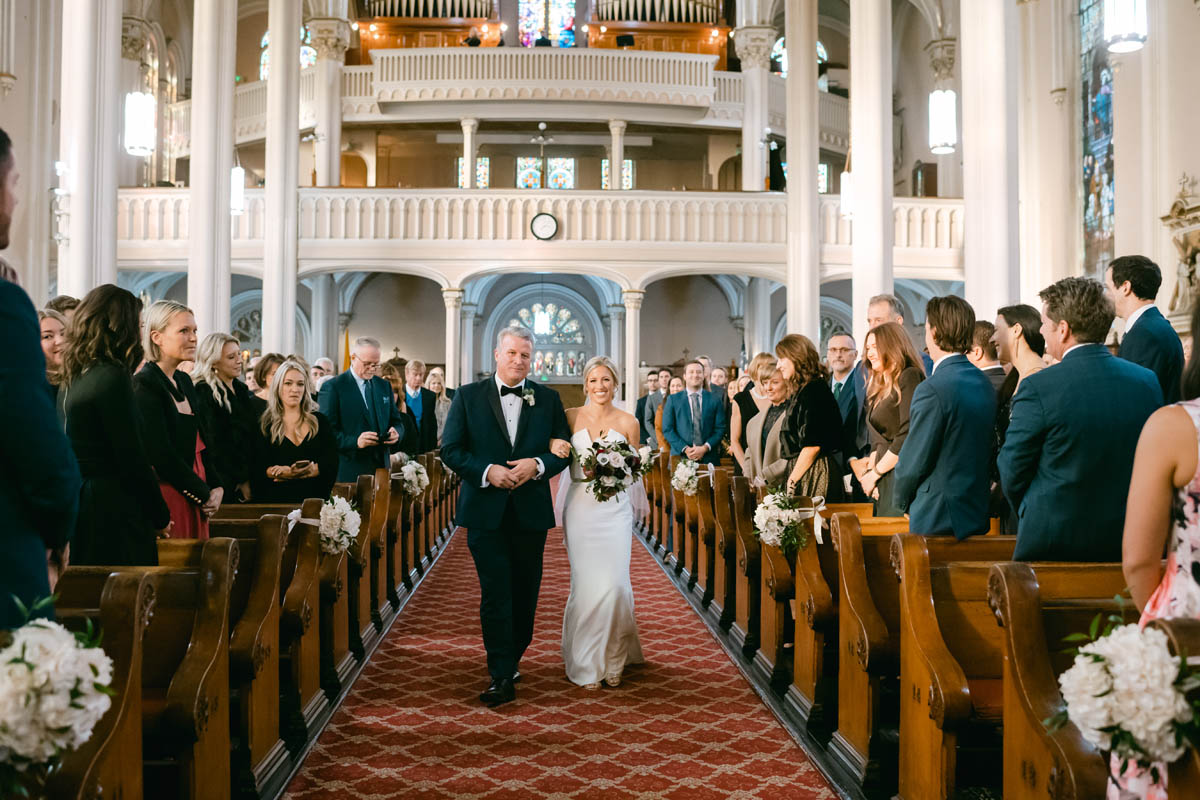 Bride walking down the aisle at St.. Michael's Church in Old Town.