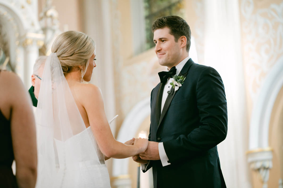 Wedding couple exchange vows at St. Michaels Church.