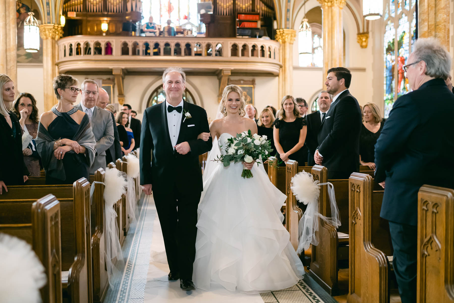 Bride walking down the aisle with her dad.