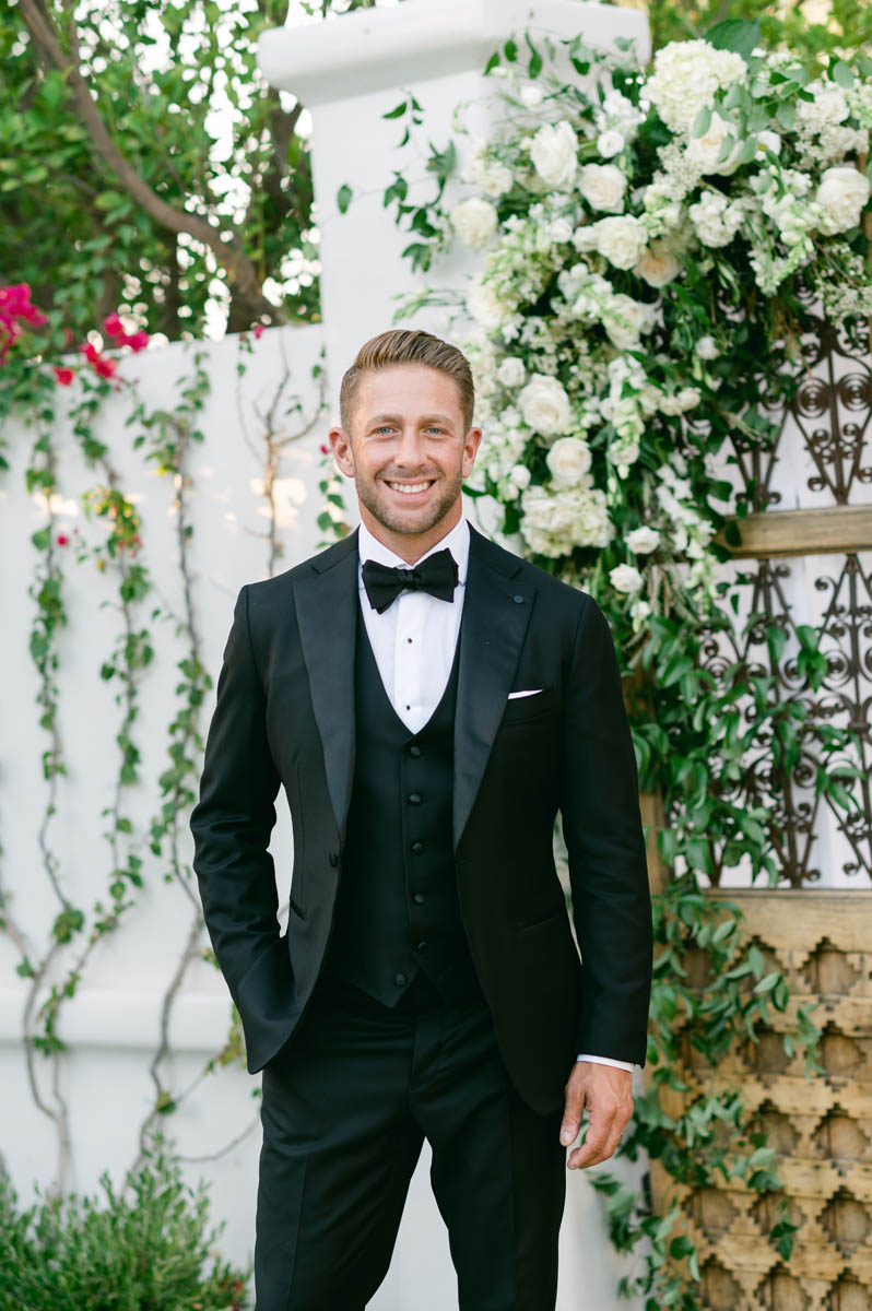 Handsome groom in black tux.
