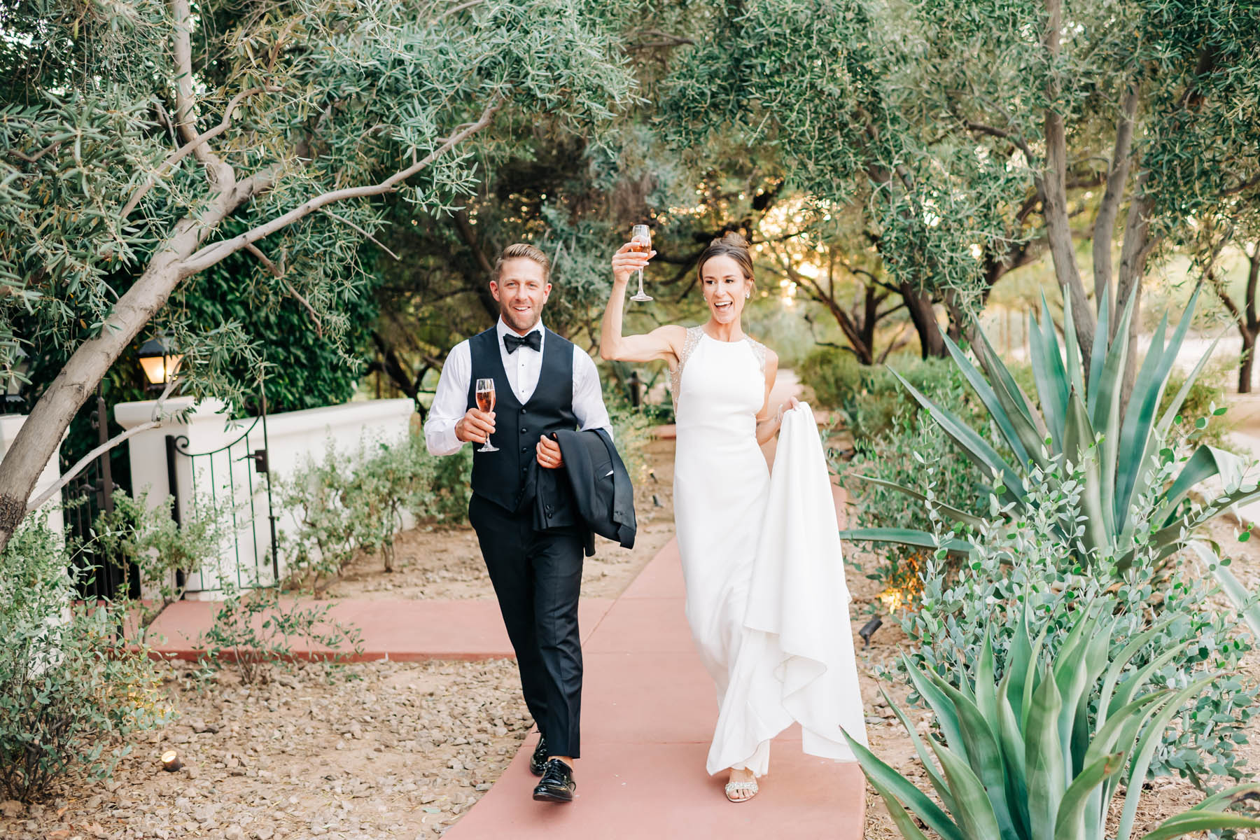Happy wedding couple with champagne.