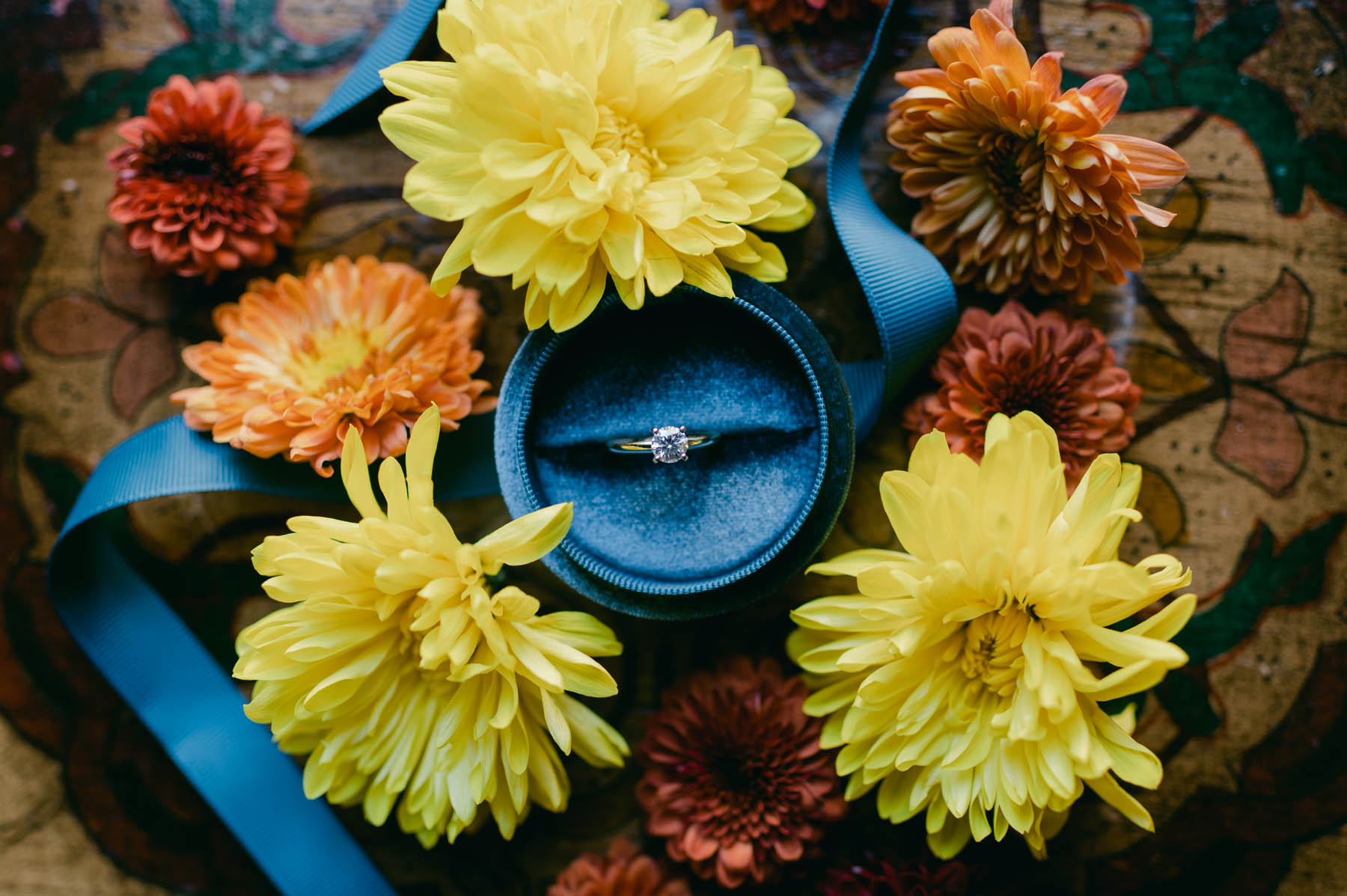 Wedding ring in fall color flowers.