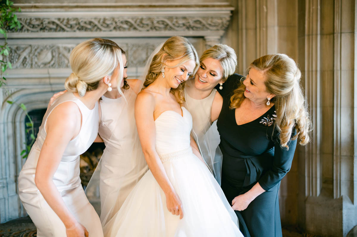 Bride with sisters on her wedding day.