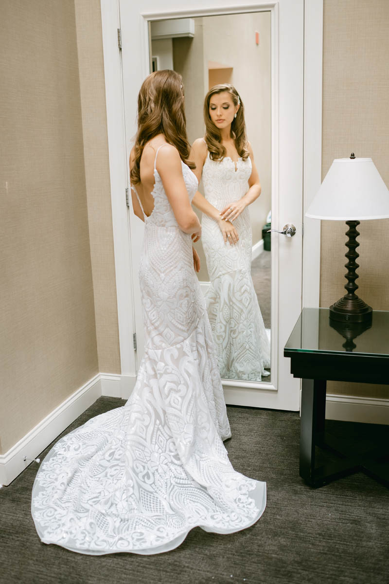 Beautiful bride posing in the mirror.