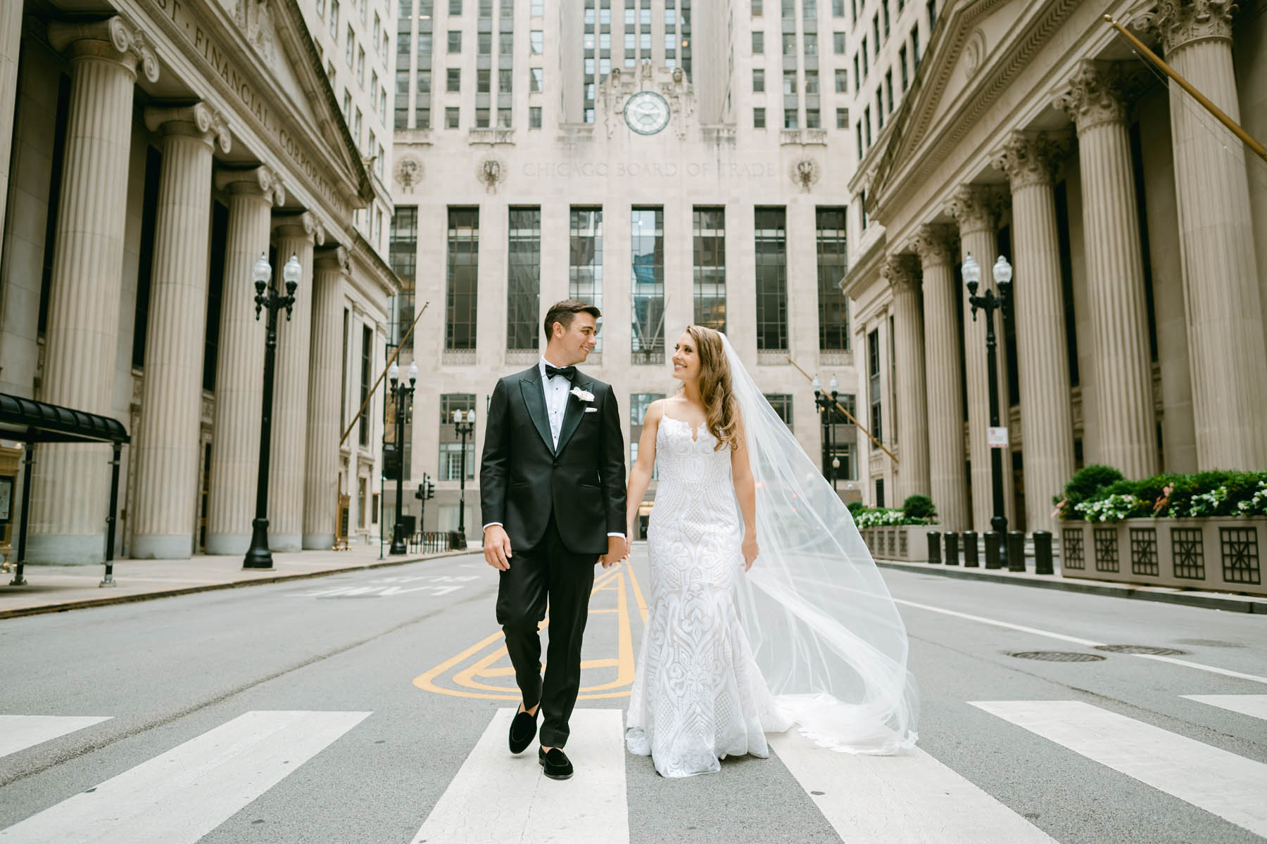 Couple posing for wedding photos at the Chicago Board of Trade