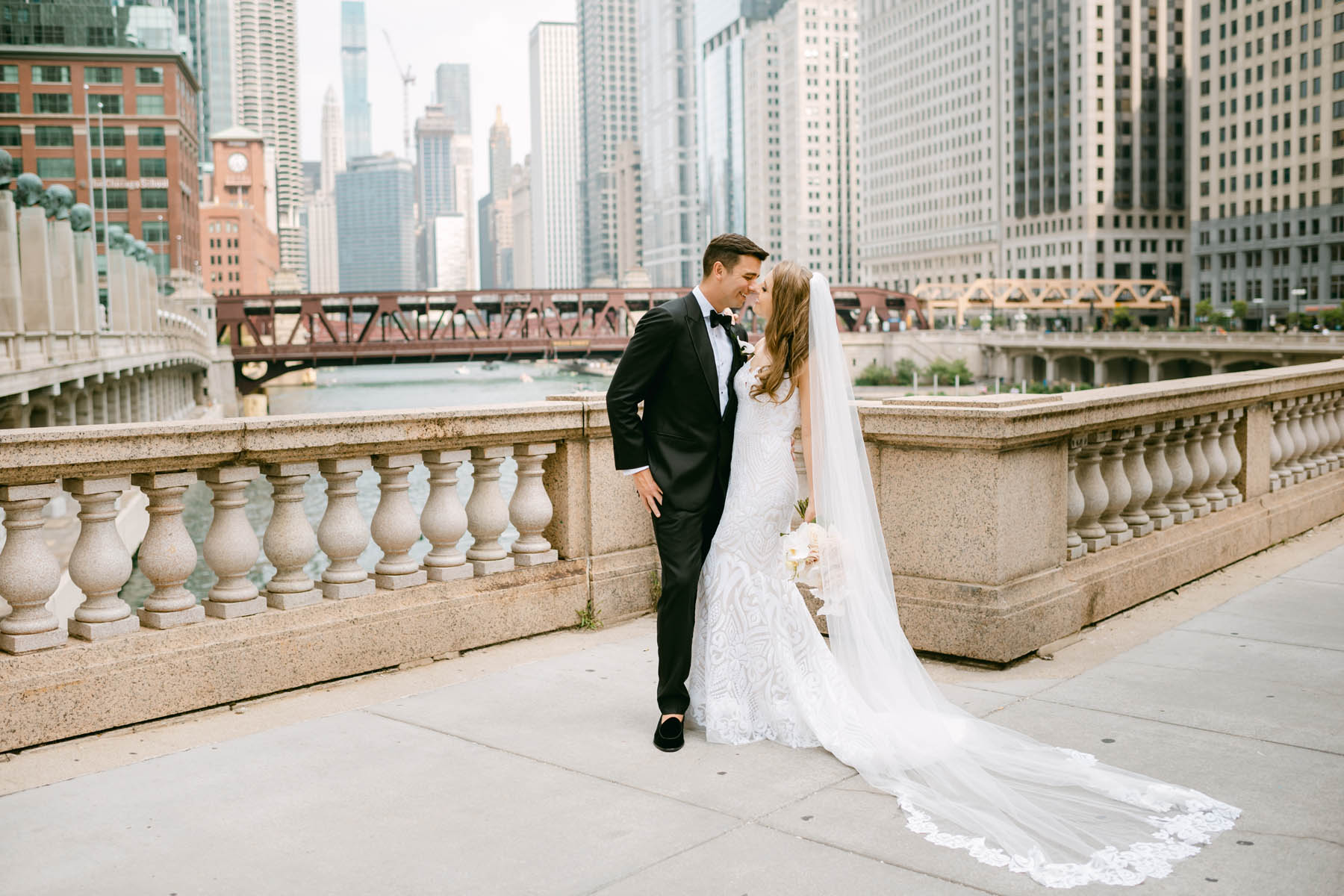Couple posing for wedding photos at the Chicago Riverwalk