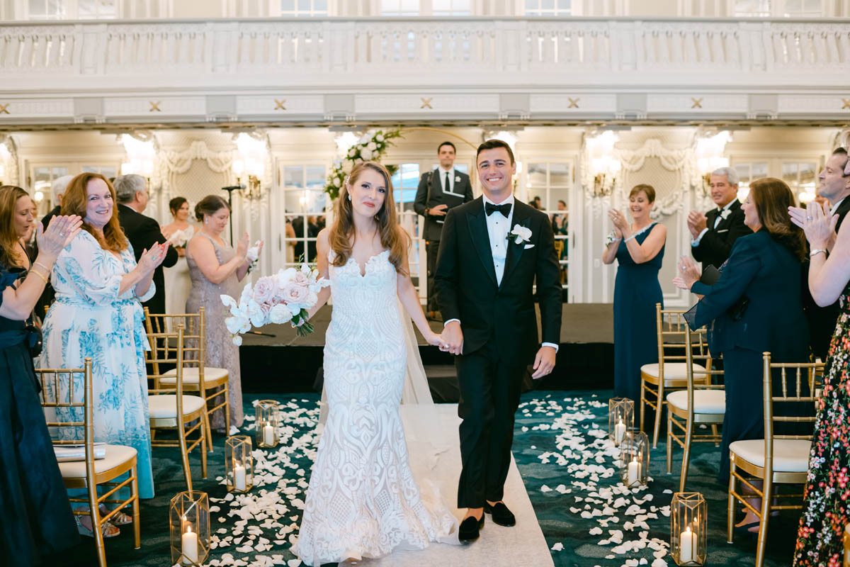 Bride and groom walking down the aisle.