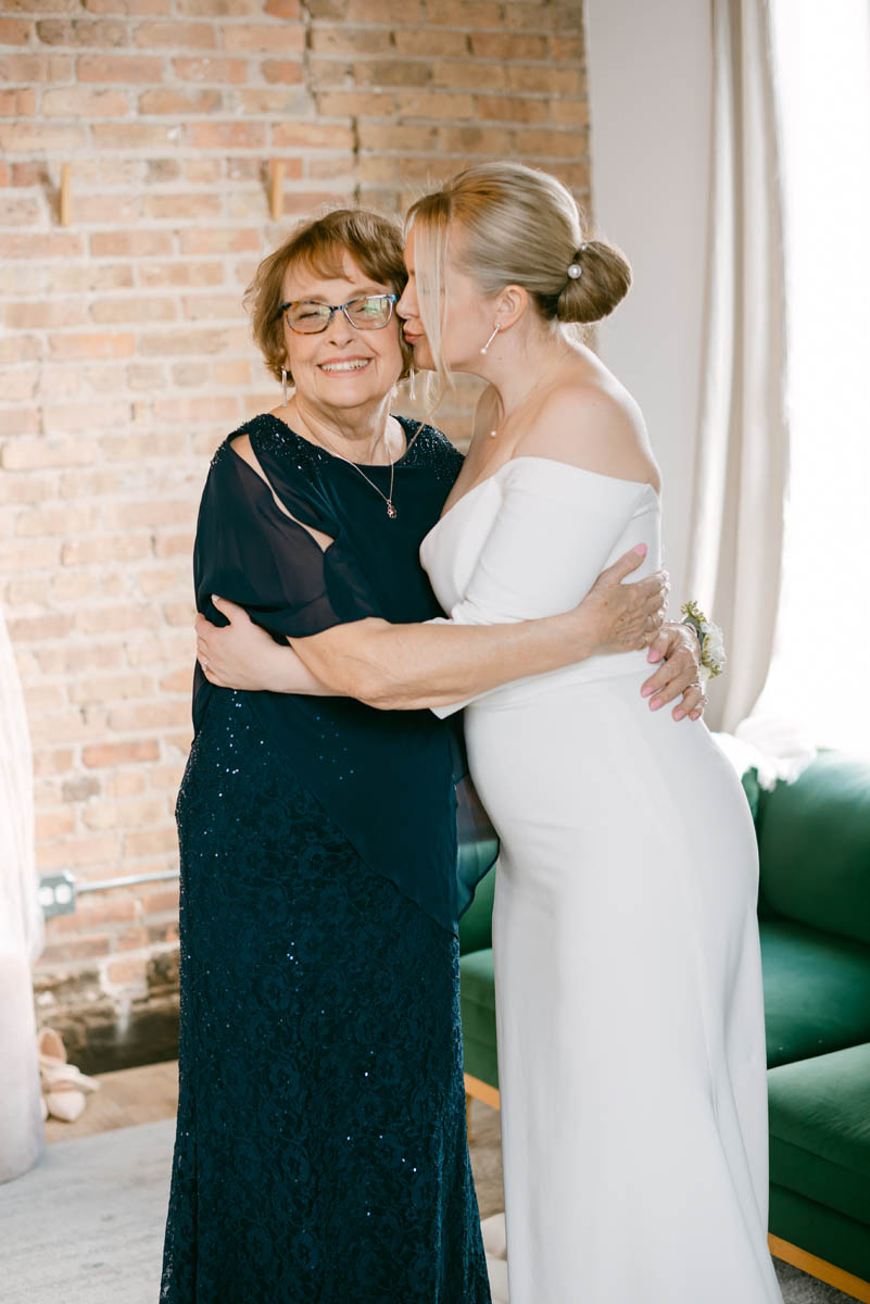 Bride hugging her mom on her wedding day.