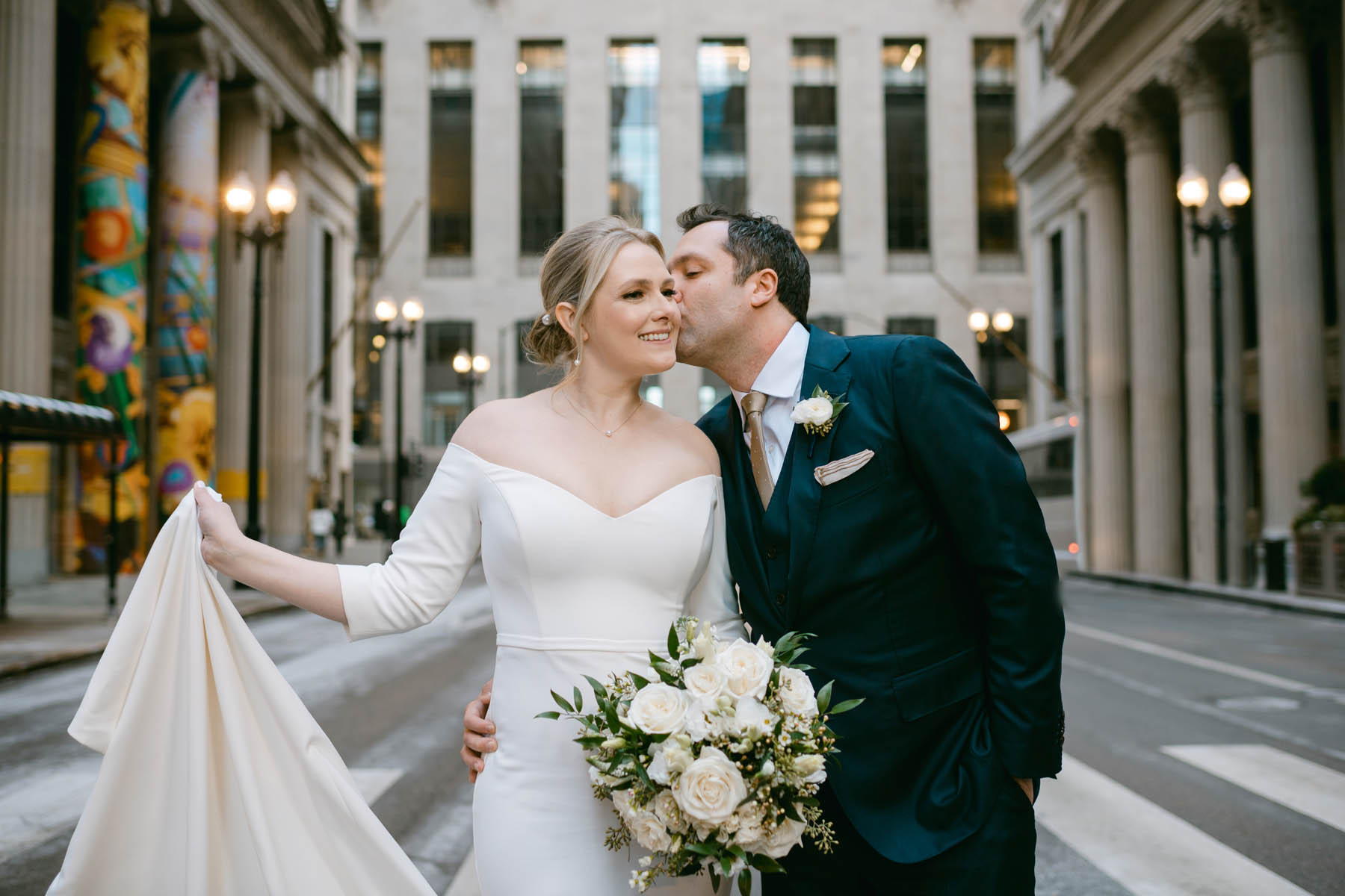 Bride and groom taking photos at the Board of Trade,
