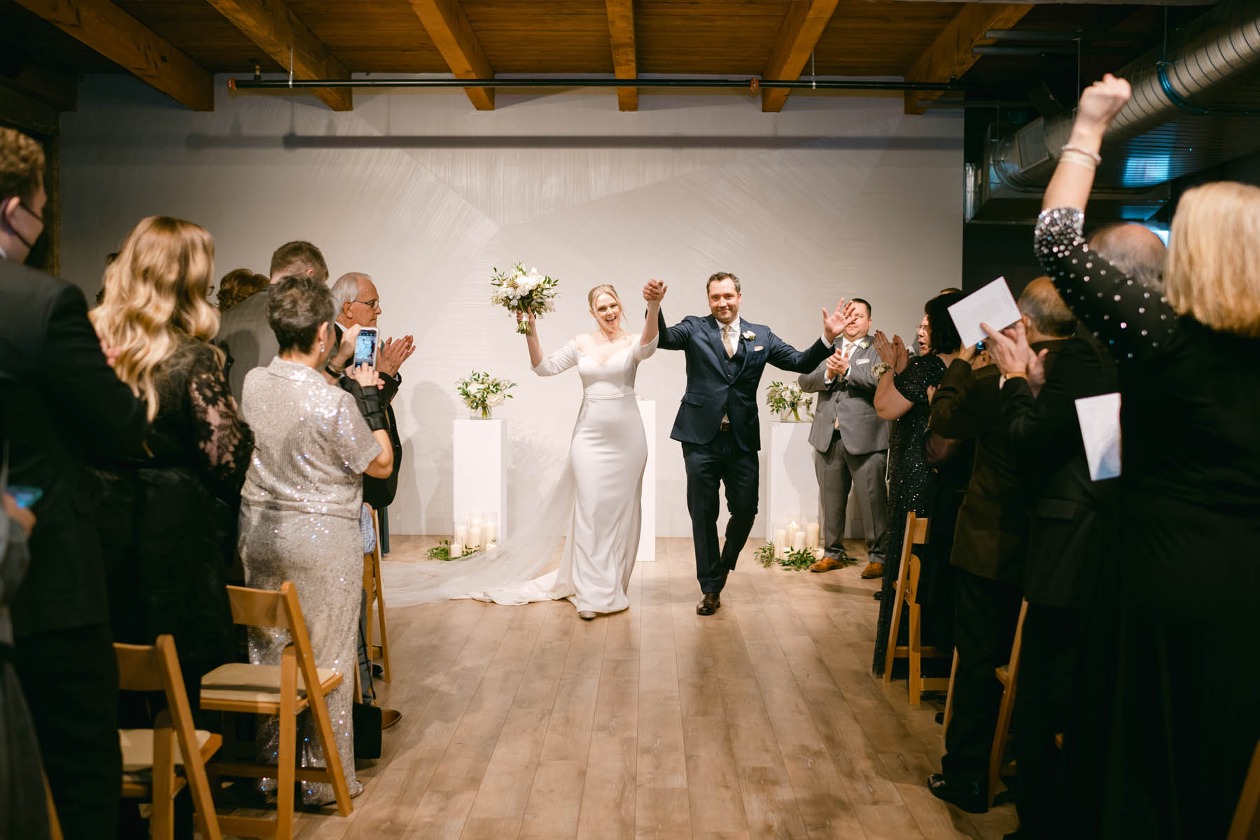Bride and groom walking down the aisle at Walden.