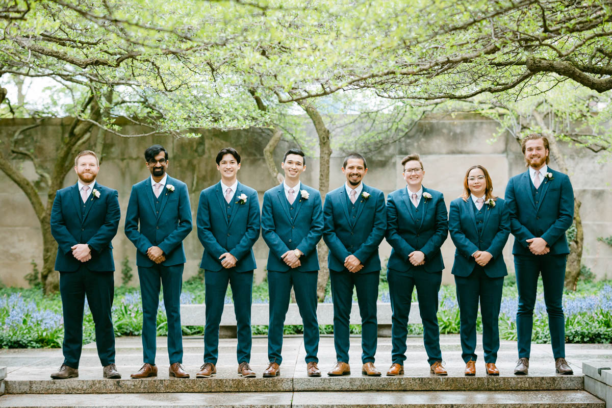 Groomsmen pose for photos.