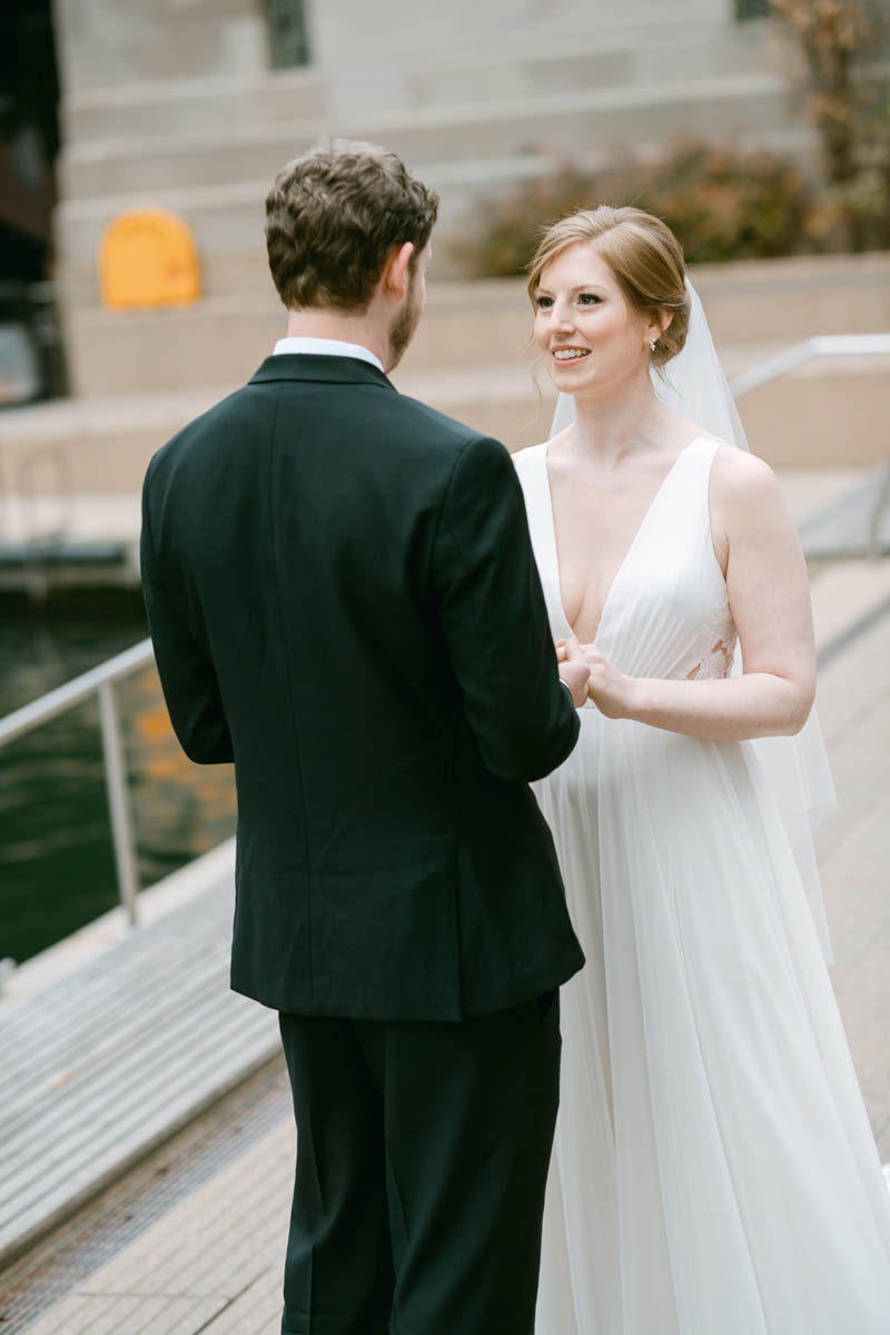Wedding couple first look along the Chicago Riverwalk.
