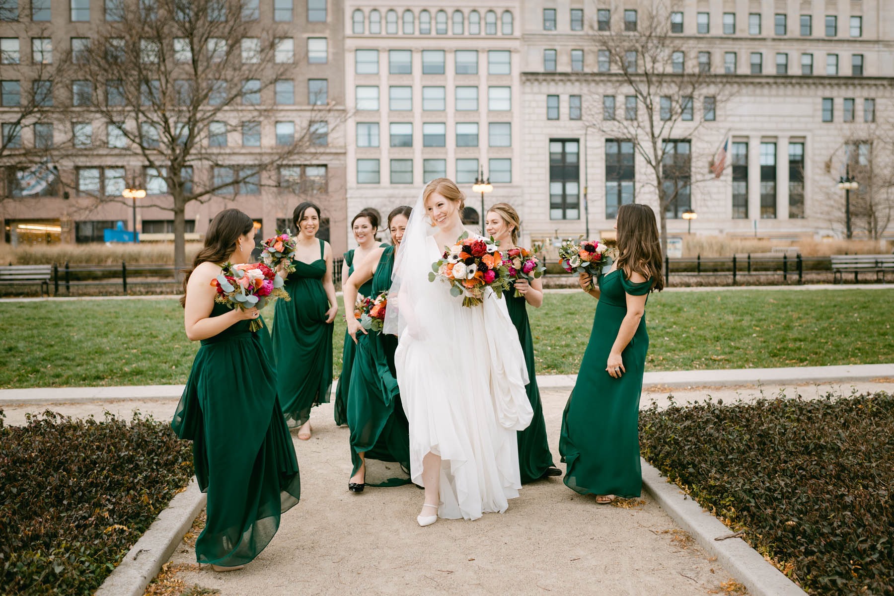 Bridesmaids in green dresses at Grant Park.
