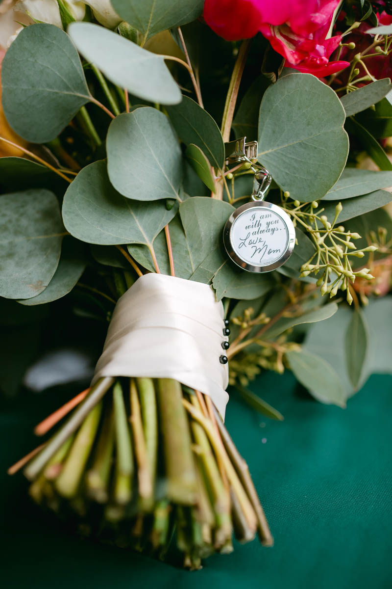 Wedding flowers with locket from bride's mom.
