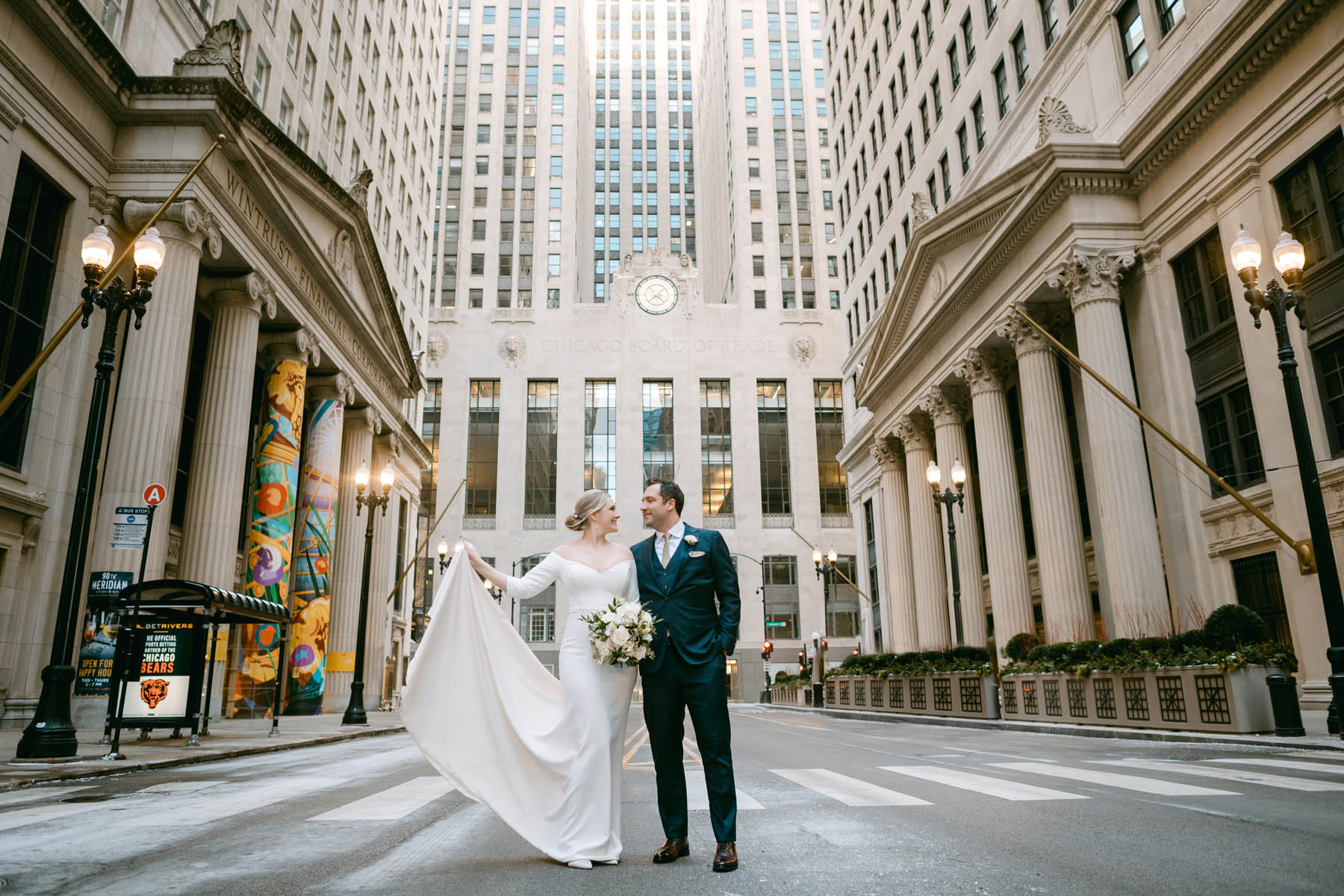 Bride and groom taking wedding photos at the Chicago Board of Trade