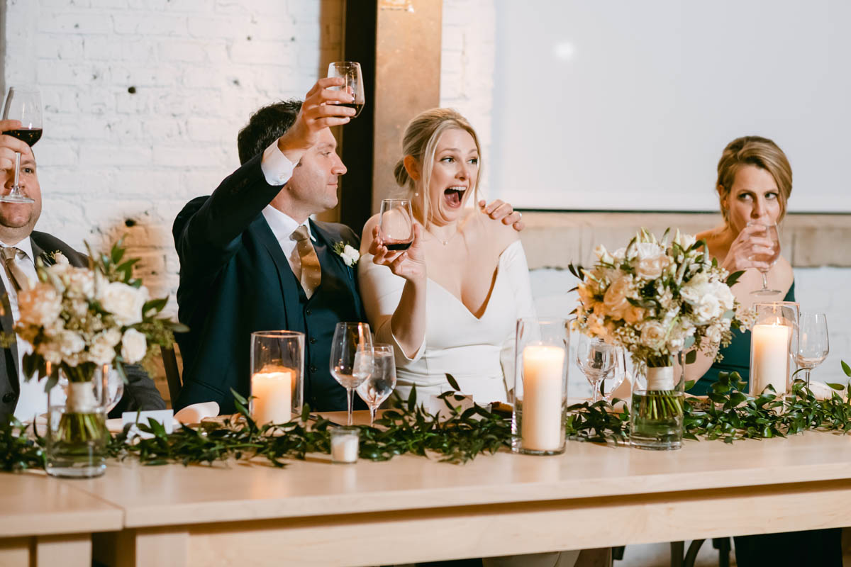 Bride and groom toasting at Walden.