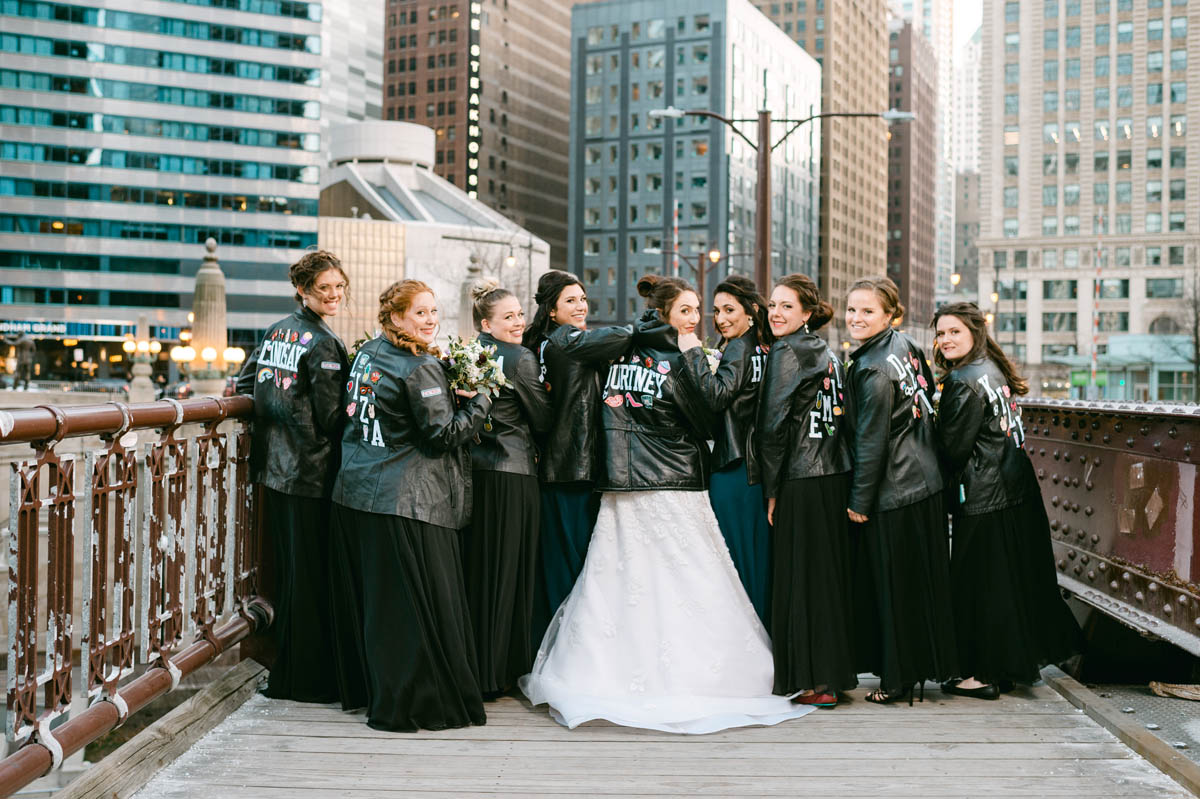 Bridesmaids in custom leather jackets with bride.