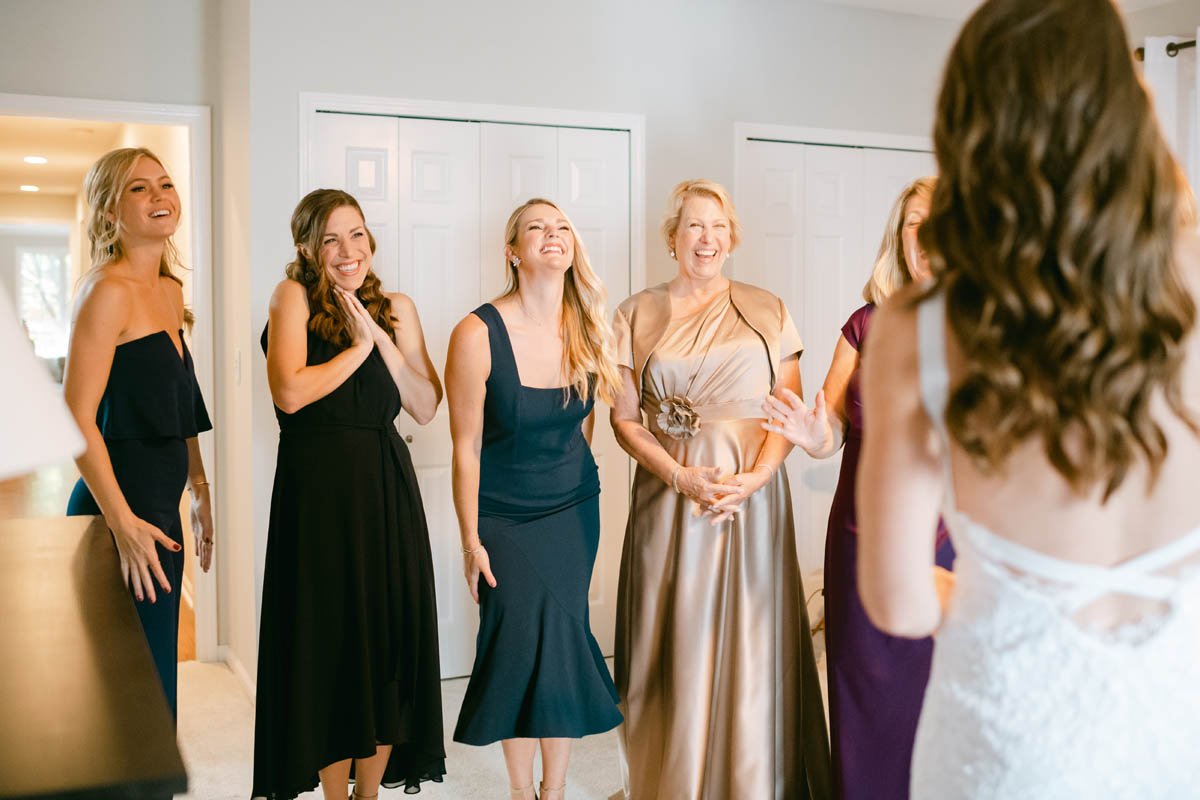 Bridesmaids excited to see bride.