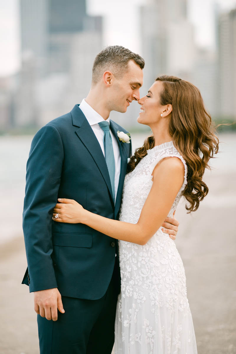 Wedding couple posing for photos at North Avenue Beach.