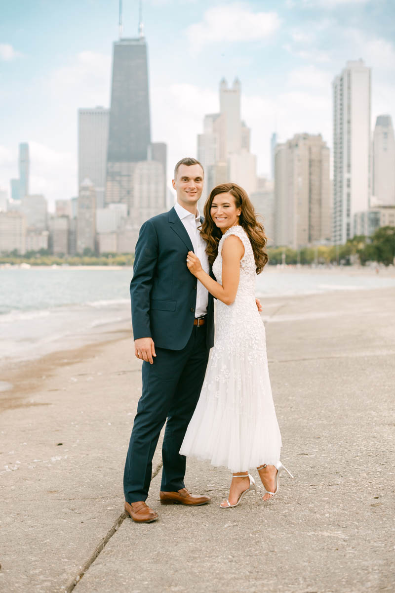 Wedding couple posing for photos at North Avenue Beach.