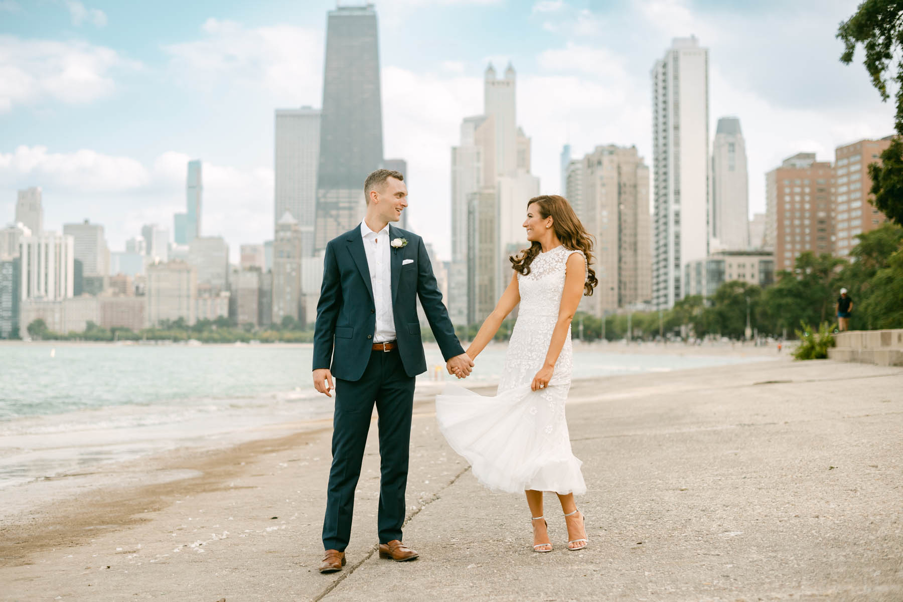 Wedding couple posing for photos at North Avenue Beach.