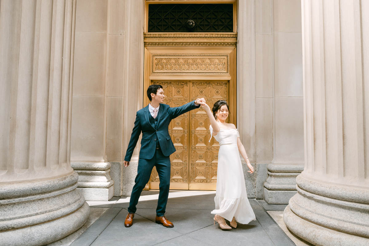 Wedding couple posing for photos at the Chicago Board of Trade.