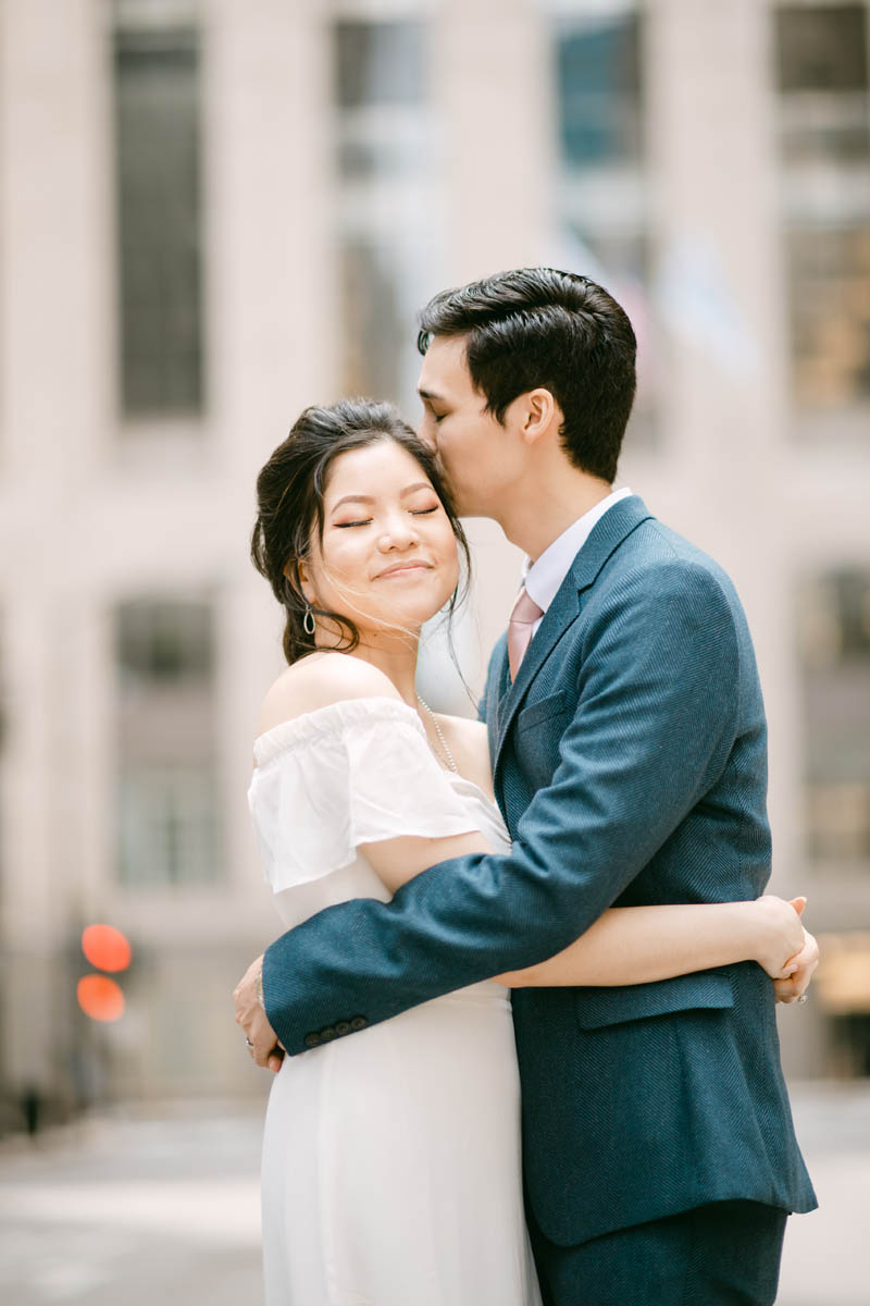 Wedding couple posing for photos at the Chicago Board of Trade.