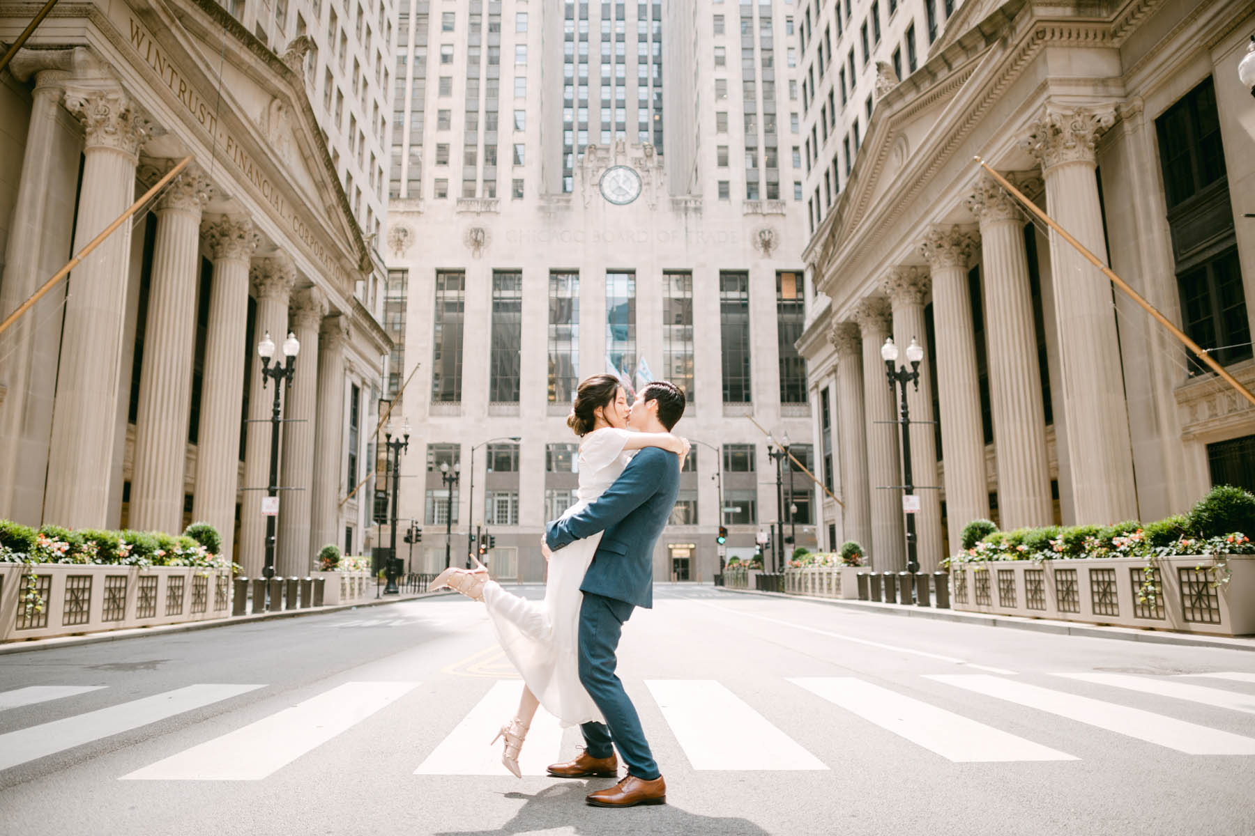 Wedding couple posing for photos at the Chicago Board of Trade.