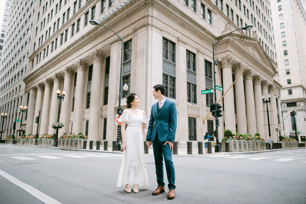Wedding couple posing for photos at the Chicago Board of Trade.