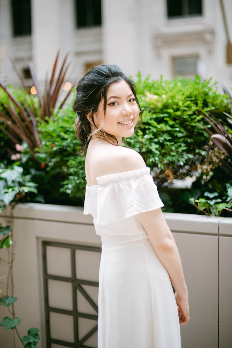 Bride posing for photos at the Chicago Board of Trade.