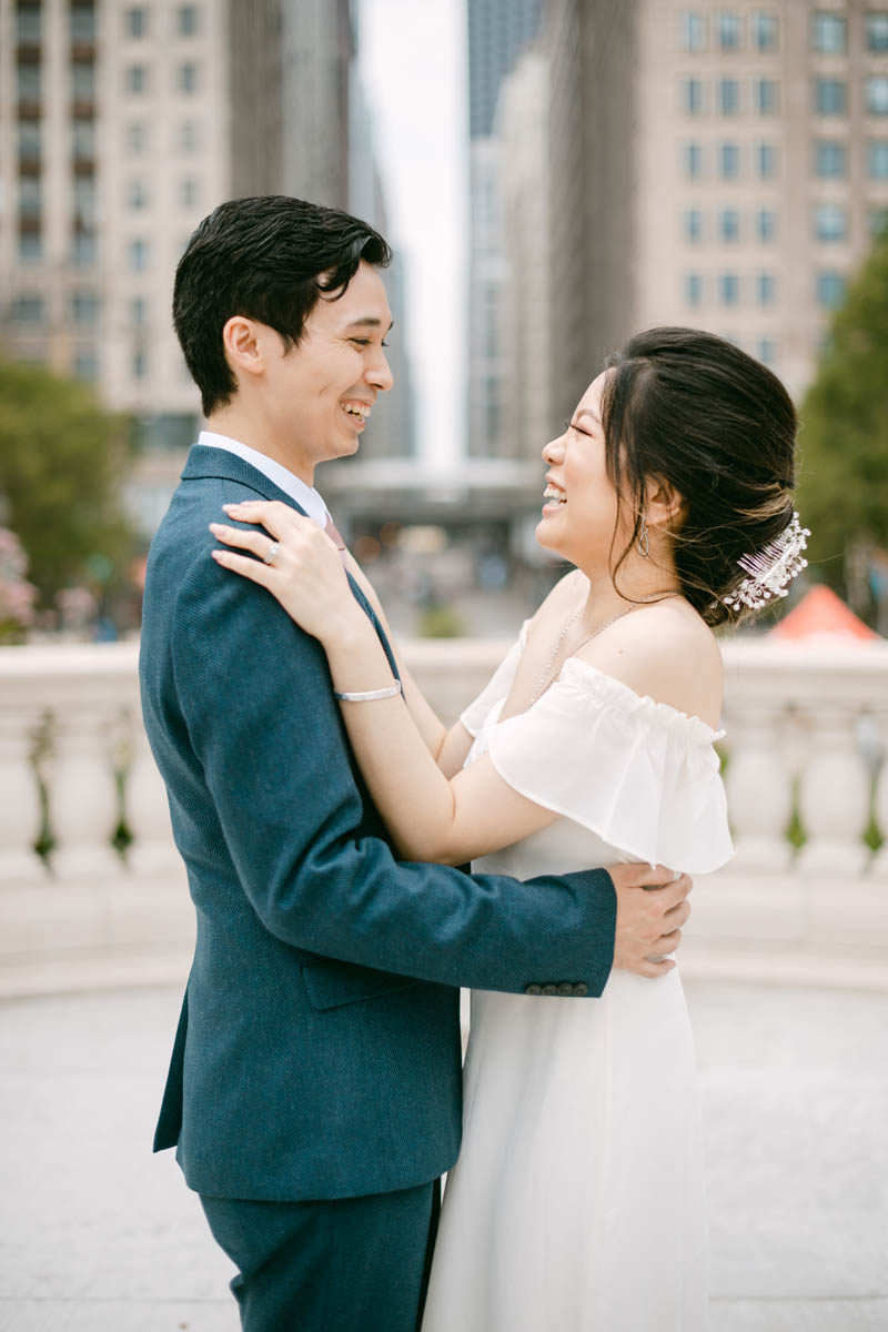 Wedding couple posing for photos at the Millennium Park.