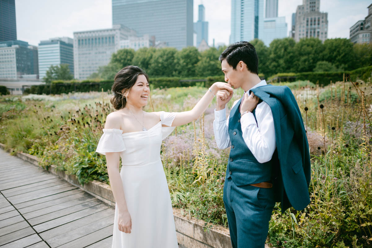 Wedding couple posing for photos at the Millennium Park Garden.