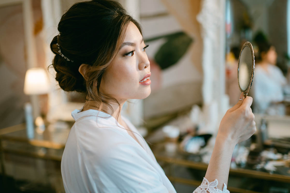 Bride looking in the mirror.