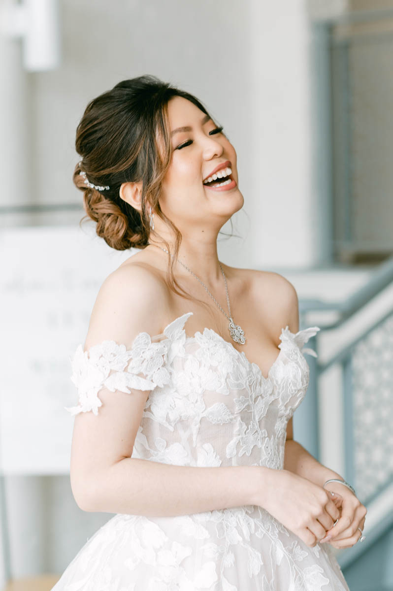 Beautiful bride laughing on her wedding day.