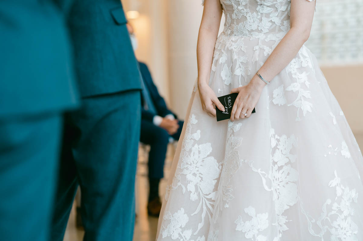 Bride holds her vows during ceremony.