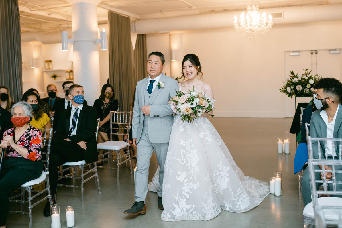 Bride walks down the aisle at Room 1520.
