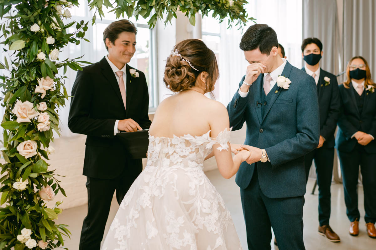 Groom tears up when he sees his bride.