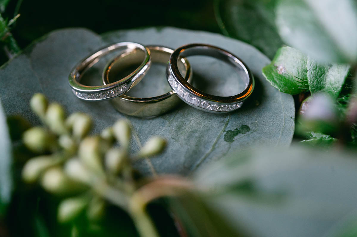Wedding rings on bouquet.