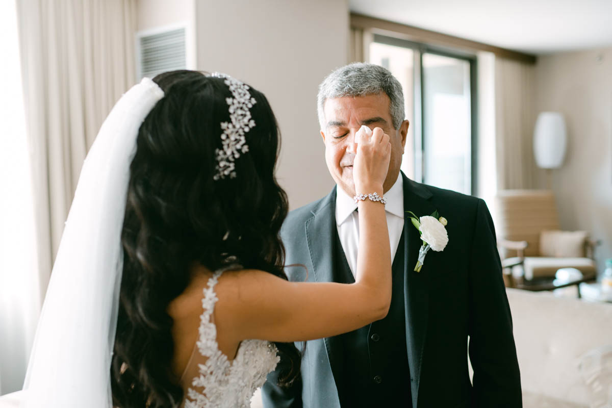 Must have wedding moment bride wiping away tears from emotional Dad.