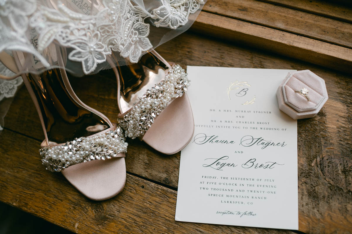 Wedding shoes and invitation.