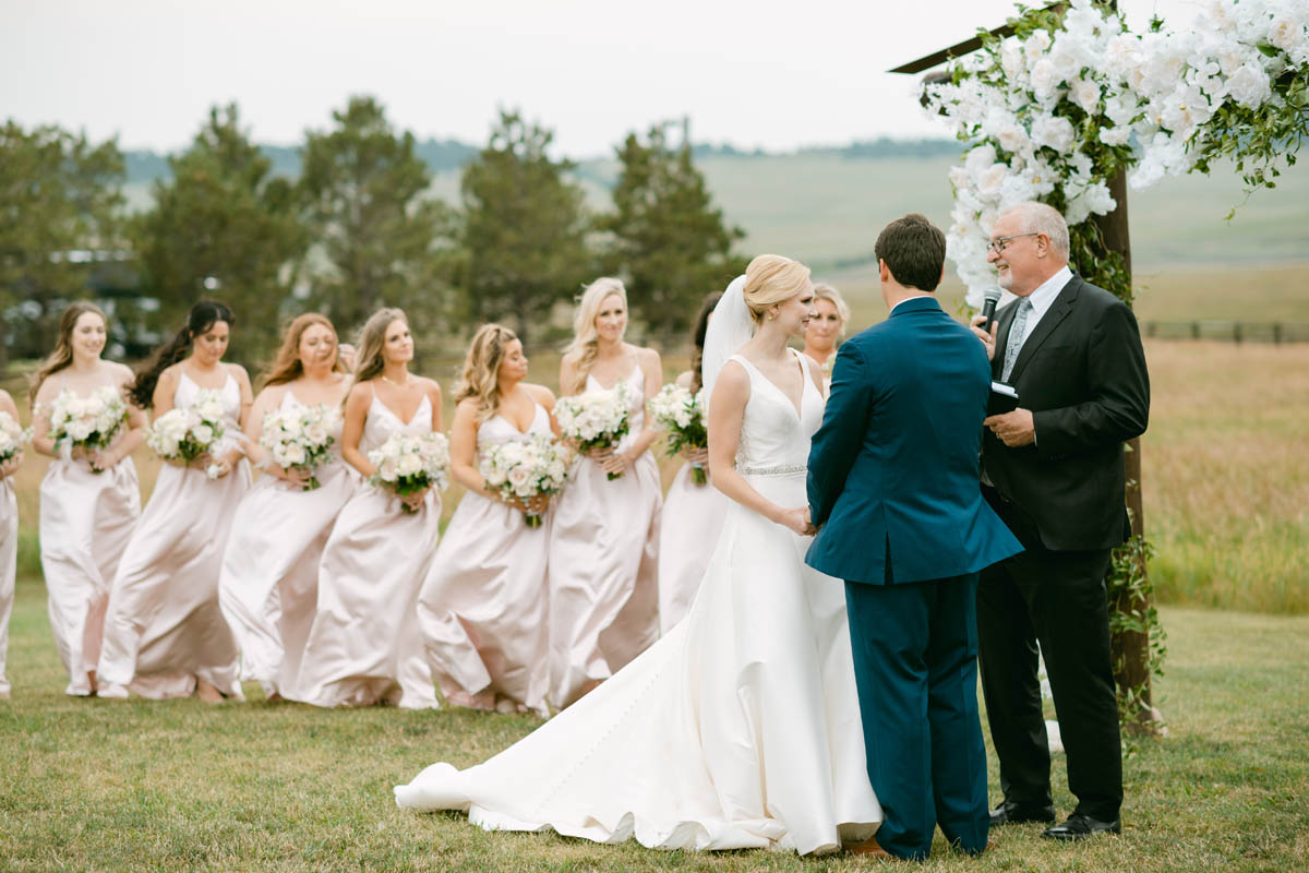 Wedding couple exchanging vows at Spruce Mountain Ranch.